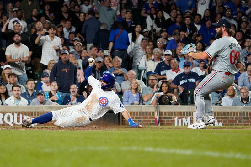 Aug 6, 2024; Chicago, Illinois, USA; Chicago Cubs shortstop Dansby Swanson (7) is safe at home plate as Minnesota Twins pitcher Randy Dobnak (68) stands nearby during the sixth inning at Wrigley Field. Mandatory Credit: David Banks-USA TODAY Sports