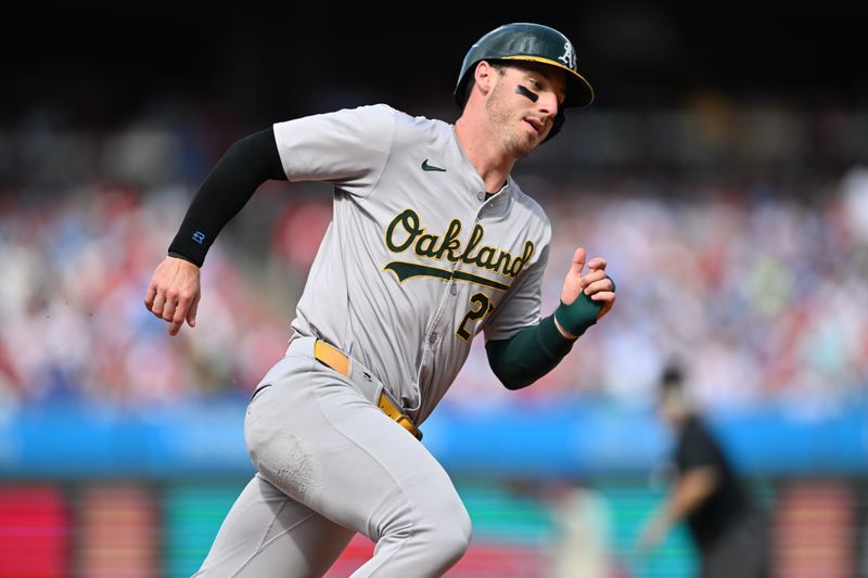 Jul 13, 2024; Philadelphia, Pennsylvania, USA; Oakland Athletics outfielder Brent Rooker (25) rounds third base and advances home to score against the Philadelphia Phillies in the second inning at Citizens Bank Park. Mandatory Credit: Kyle Ross-USA TODAY Sports