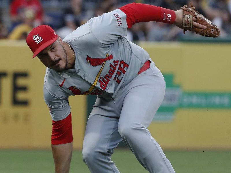 Jul 2, 2024; Pittsburgh, Pennsylvania, USA;  St. Louis Cardinals third baseman Nolan Arenado (28) fails to field a ground ball hit for a single by Pittsburgh Pirates first baseman Connor Joe (not pictured) during the sixth inning at PNC Park. Mandatory Credit: Charles LeClaire-USA TODAY Sports