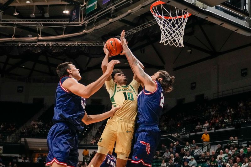 Jan 6, 2024; Charlotte, North Carolina, USA; Charlotte 49ers guard Nik Graves (10) tries for the basket against Florida Atlantic Owls center Vladislav Goldin (50) and guard Nicholas Boyd (2) during the first half at Dale F. Halton Arena. Mandatory Credit: Jim Dedmon-USA TODAY Sports