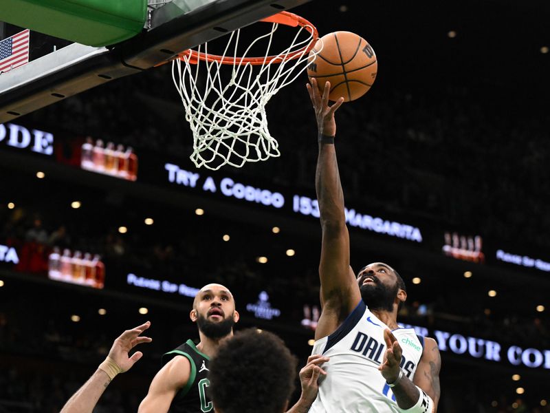 BOSTON, MASSACHUSETTS - MARCH 01: Kyrie Irving #11 of the Dallas Mavericks attempts a layup against the Boston Celtics during the second quarter at the TD Garden on March 01, 2024 in Boston, Massachusetts. NOTE TO USER: User expressly acknowledges and agrees that, by downloading and or using this photograph, User is consenting to the terms and conditions of the Getty Images License Agreement. (Photo by Brian Fluharty/Getty Images)