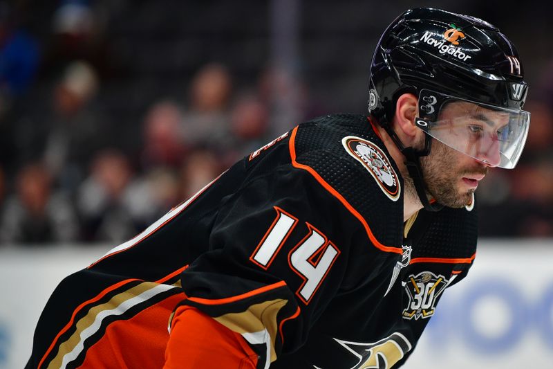 Jan 5, 2024; Anaheim, California, USA; Anaheim Ducks center Adam Henrique (14) takes the face off against the Winnipeg Jets during the second period at Honda Center. Mandatory Credit: Gary A. Vasquez-USA TODAY Sports