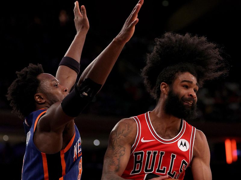 NEW YORK, NEW YORK - APRIL 14: Coby White #0 of the Chicago Bulls looks to pass as OG Anunoby #8 of the New York Knicks defends during the second half at Madison Square Garden on April 14, 2024 in New York City. The New York Knicks defeated the Chicago Bulls 120-119 in OT. NOTE TO USER: User expressly acknowledges and agrees that, by downloading and or using this photograph, User is consenting to the terms and conditions of the Getty Images License Agreement. (Photo by Elsa/Getty Images)