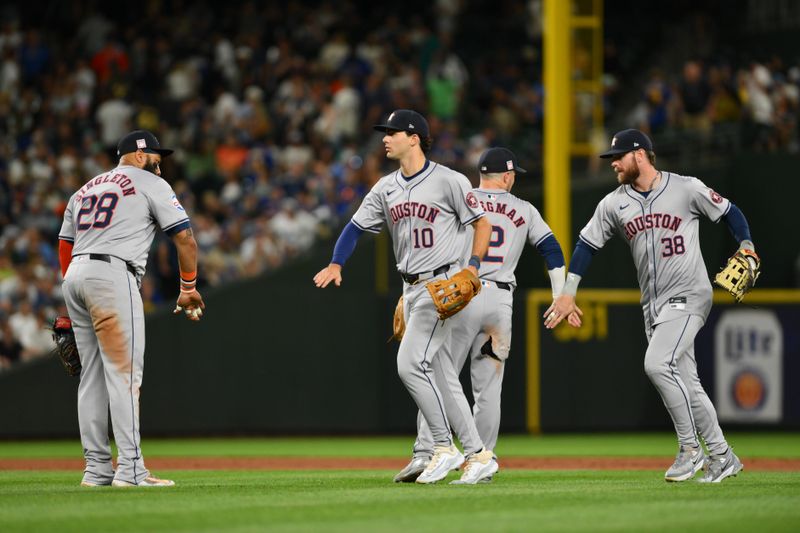 Jul 19, 2024; Seattle, Washington, USA; The Houston Astros celebrate defeating the Seattle Mariners at T-Mobile Park. Mandatory Credit: Steven Bisig-USA TODAY Sports