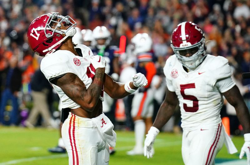 Nov 25, 2023; Auburn, Alabama, USA; Alabama Crimson Tide wide receiver Isaiah Bond (17) celebrates his game winning touchdown in the end zone during the fourth quarter against the Auburn Tigers at Jordan-Hare Stadium. Mandatory Credit: John David Mercer-USA TODAY Sports