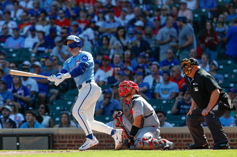 Sep 26, 2025; Chicago, Illinois, USA; Chicago Cubs second baseman Nico Hoerner (2) hits a solo home run against the St. Louis Cardinals during the first inning at Wrigley Field. Mandatory Credit: Kamil Krzaczynski-Imagn Images