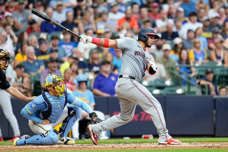 Jul 12, 2024; Milwaukee, Wisconsin, USA;  Washington Nationals catcher Keibert Ruiz (20) hits an RBI single during the fourth inning against the Milwaukee Brewers at American Family Field. Mandatory Credit: Jeff Hanisch-USA TODAY Sports