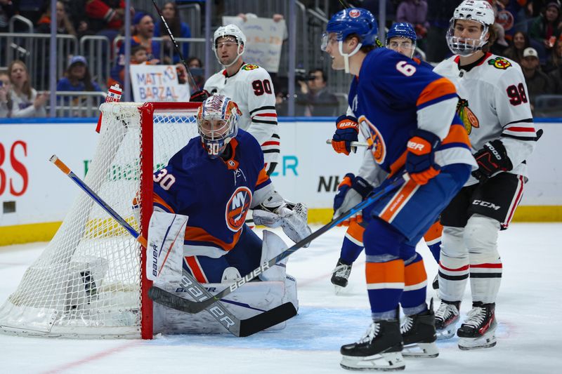 Apr 2, 2024; Elmont, New York, USA; New York Islanders goaltender Ilya Sorokin (30) looks for the puck against the Chicago Blackhawks during the third period at UBS Arena. Mandatory Credit: Thomas Salus-USA TODAY Sports