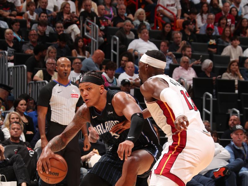 MIAMI, FL - OCTOBER 23: Paolo Banchero #5 of the Orlando Magic handles the ball during the game against the Miami Heat on October 23, 2024 at Kaseya Center in Miami, Florida. NOTE TO USER: User expressly acknowledges and agrees that, by downloading and or using this Photograph, user is consenting to the terms and conditions of the Getty Images License Agreement. Mandatory Copyright Notice: Copyright 2024 NBAE (Photo by Issac Baldizon/NBAE via Getty Images)