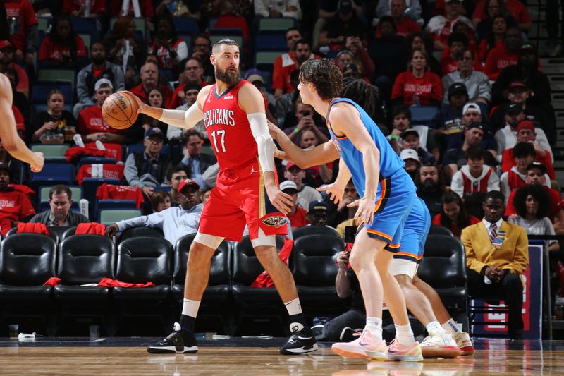 NEW ORLEANS, LA - APRIL 12: Jonas Valanciunas #17 of the New Orleans Pelicans looks to pass the ball during the game against the Oklahoma City Thunder during the 2023 Play-In Tournament on April 12, 2023 at the Smoothie King Center in New Orleans, Louisiana. NOTE TO USER: User expressly acknowledges and agrees that, by downloading and or using this Photograph, user is consenting to the terms and conditions of the Getty Images License Agreement. Mandatory Copyright Notice: Copyright 2023 NBAE (Photo by Layne Murdoch Jr./NBAE via Getty Images)