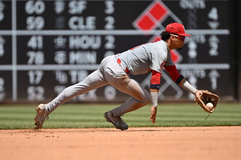 Jul 7, 2024; Washington, District of Columbia, USA; St. Louis Cardinals shortstop Masyn Winn (0) tosses the ball out of his glove to start a double play against the Washington Nationals during the fourth inning at Nationals Park. Mandatory Credit: Rafael Suanes-USA TODAY Sports