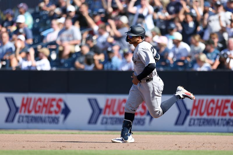Apr 19, 2025; Tampa, Florida, USA; New York Yankees center fielder Trent Grisham (12) runs the bases after hitting a home run against the Tampa Bay Rays in the second inning at George M. Steinbrenner Field. Mandatory Credit: Nathan Ray Seebeck-Imagn Images