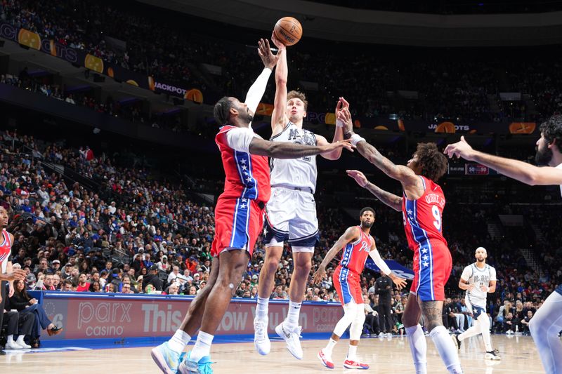 PHILADELPHIA, PA - DECEMBER 6: Franz Wagner #22 of the Orlando Magic drives to the basket during the game against the Philadelphia 76ers on December 6, 2024 at the Wells Fargo Center in Philadelphia, Pennsylvania NOTE TO USER: User expressly acknowledges and agrees that, by downloading and/or using this Photograph, user is consenting to the terms and conditions of the Getty Images License Agreement. Mandatory Copyright Notice: Copyright 2024 NBAE (Photo by Jesse D. Garrabrant/NBAE via Getty Images)