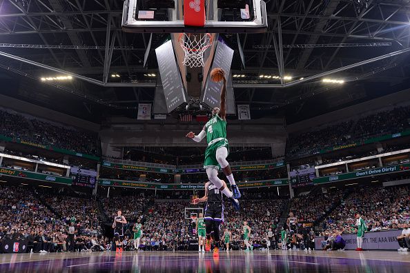 SACRAMENTO, CA - DECEMBER 20:  Jrue Holiday #4 of the Boston Celtics goes to the basket during the game on December 20, 2023 at Golden 1 Center in Sacramento, California. NOTE TO USER: User expressly acknowledges and agrees that, by downloading and or using this Photograph, user is consenting to the terms and conditions of the Getty Images License Agreement. Mandatory Copyright Notice: Copyright 2023 NBAE (Photo by Rocky Widner/NBAE via Getty Images)