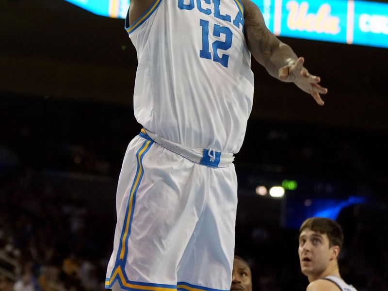 Dec 19, 2023; Los Angeles, California, USA; UCLA Bruins guard Sebastian Mack (12) shoots the ball against the Cal State Northridge Matadors in the second half at Pauley Pavilion presented by Wescom. CSUN defeated UCLA 76-72. Mandatory Credit: Kirby Lee-USA TODAY Sports