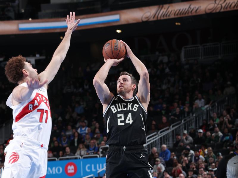 MILWAUKEE, WI - NOVEMBER 12:  Pat Connaughton #24 of the Milwaukee Bucks shoots a three point basket during the game against the Toronto Raptors during the Emirates NBA Cup game on November 12, 2024 at Fiserv Forum Center in Milwaukee, Wisconsin. NOTE TO USER: User expressly acknowledges and agrees that, by downloading and or using this Photograph, user is consenting to the terms and conditions of the Getty Images License Agreement. Mandatory Copyright Notice: Copyright 2024 NBAE (Photo by Gary Dineen/NBAE via Getty Images).