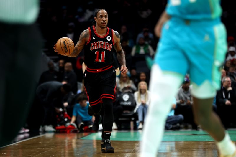 CHARLOTTE, NORTH CAROLINA - JANUARY 31: DeMar DeRozan #11 of the Chicago Bulls brings the ball down the court during the first half of an NBA game against the Charlotte Hornets at Spectrum Center on January 31, 2024 in Charlotte, North Carolina. NOTE TO USER: User expressly acknowledges and agrees that, by downloading and or using this photograph, User is consenting to the terms and conditions of the Getty Images License Agreement. (Photo by David Jensen/Getty Images)