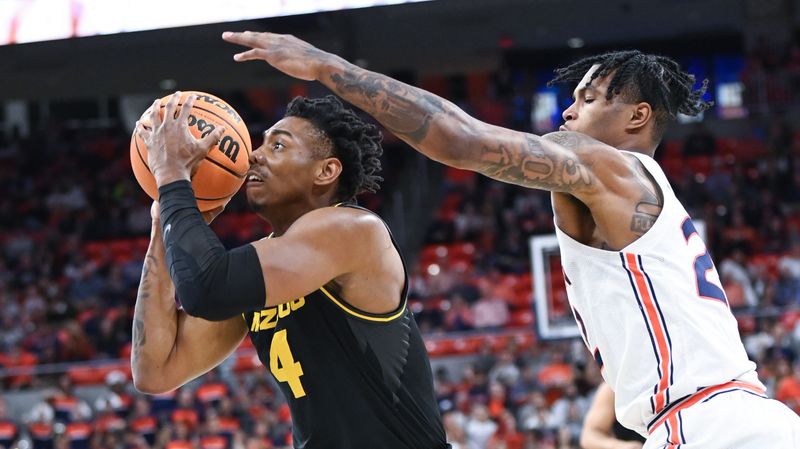 Feb 14, 2023; Auburn, Alabama, USA;  Missouri Tigers guard DeAndre Gholston (4) shoots defended by Auburn Tigers guard Allen Flanigan (22) during the first half at Neville Arena. Mandatory Credit: Julie Bennett-USA TODAY Sports