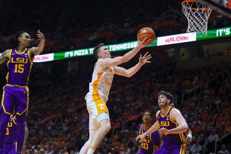 Feb 7, 2024; Knoxville, Tennessee, USA; Tennessee Volunteers guard Dalton Knecht (3) goes to the basket against the LSU Tigers during the second half at Thompson-Boling Arena at Food City Center. Mandatory Credit: Randy Sartin-USA TODAY Sports