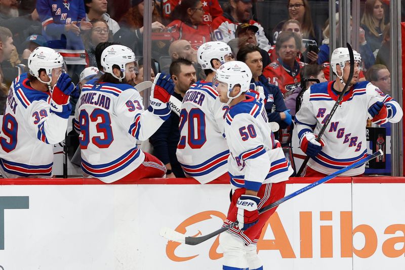 Oct 29, 2024; Washington, District of Columbia, USA; New York Rangers left wing Will Cuylle (50) celebrates with teammates after scoring a goal against the Washington Capitals in the first period at Capital One Arena. Mandatory Credit: Geoff Burke-Imagn Images