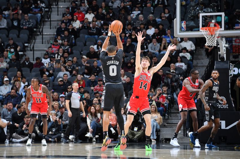 SAN ANTONIO, TX - DECEMBER 5: Keldon Johnson #0 of the San Antonio Spurs shoots a three point basket during the game  against the Chicago Bulls on December 5, 2024 at the Frost Bank Center in San Antonio, Texas. NOTE TO USER: User expressly acknowledges and agrees that, by downloading and or using this photograph, user is consenting to the terms and conditions of the Getty Images License Agreement. Mandatory Copyright Notice: Copyright 2024 NBAE (Photos by Michael Gonzales/NBAE via Getty Images)