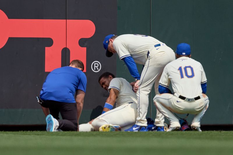 Jul 21, 2024; Seattle, Washington, USA; Seattle Mariners center fielder Julio Rodríguez (44) is assisted on the field after an injury during the sixth inning at T-Mobile Park. Mandatory Credit: John Froschauer-USA TODAY Sports