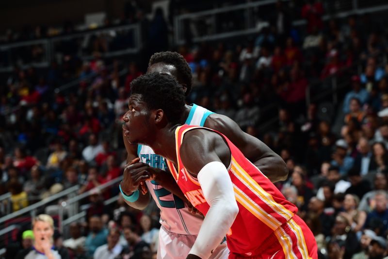 ATLANTA, GA - APRIL 10: Mouhamed Gueye #18 of the Atlanta Hawks boxes out against JT Thor #21 of the Charlotte Hornets during the game on April 10, 2024 at State Farm Arena in Atlanta, Georgia.  NOTE TO USER: User expressly acknowledges and agrees that, by downloading and/or using this Photograph, user is consenting to the terms and conditions of the Getty Images License Agreement. Mandatory Copyright Notice: Copyright 2024 NBAE (Photo by Scott Cunningham/NBAE via Getty Images)