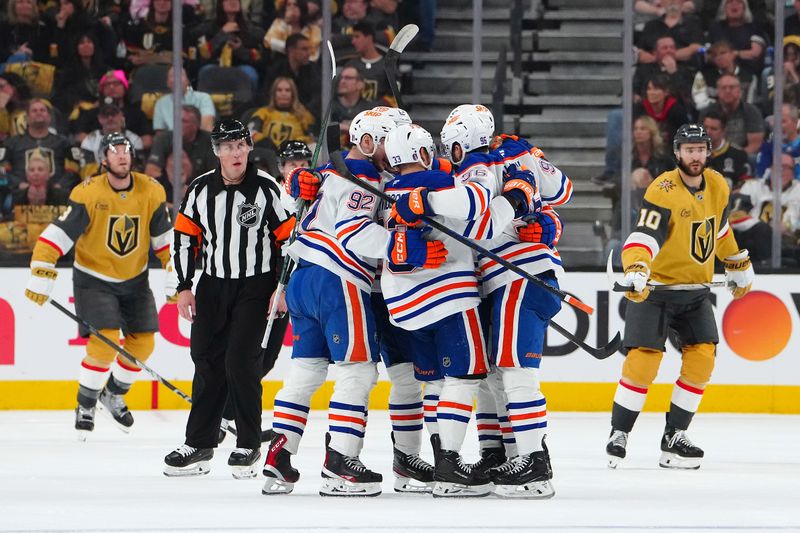 May 8, 2025; Las Vegas, Nevada, USA; Edmonton Oilers defenseman Jake Walman (96) celebrates with team mates after scoring a goal against the Vegas Golden Knights during the second period of game two of the second round of the 2025 Stanley Cup Playoffs at T-Mobile Arena. Mandatory Credit: Stephen R. Sylvanie-Imagn Images