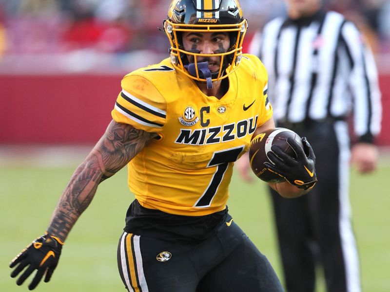 Nov 24, 2023; Fayetteville, Arkansas, USA; Missouri Tigers running back Cody Schrader (70 rushes during the first quarter against the Arkansas Razorbacks at Donald W. Reynolds Razorback Stadium. Mandatory Credit: Nelson Chenault-USA TODAY Sports