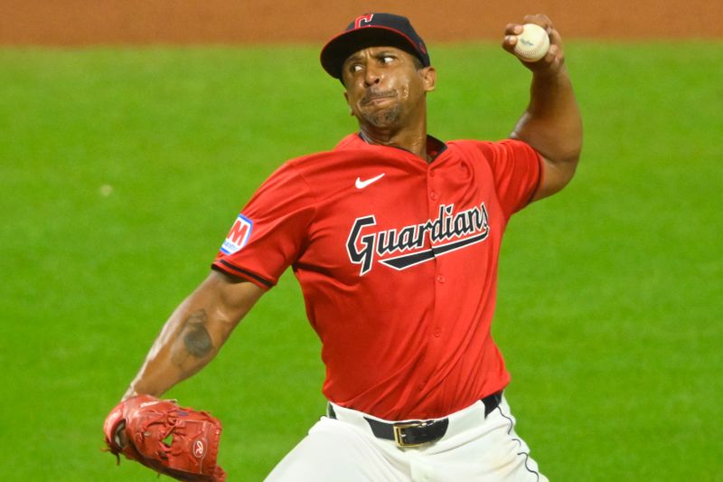 Aug 27, 2024; Cleveland, Ohio, USA; Cleveland Guardians relief pitcher Anthony Gose (26) delivers a pitch in the seventh inning against the Kansas City Royals at Progressive Field. Mandatory Credit: David Richard-USA TODAY Sports