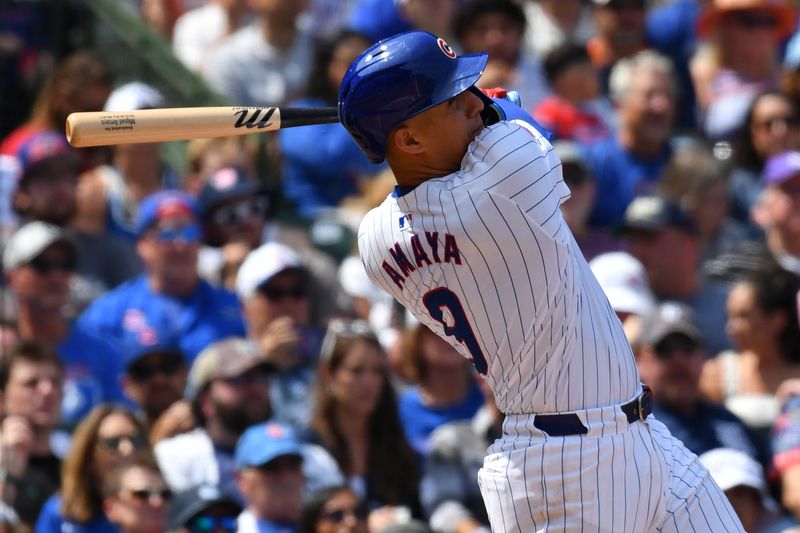 Aug 22, 2024; Chicago, Illinois, USA; Chicago Cubs catcher Miguel Amaya (9) hits a grand slam during the second inning against the Detroit Tigers at Wrigley Field. Mandatory Credit: Patrick Gorski-USA TODAY Sports