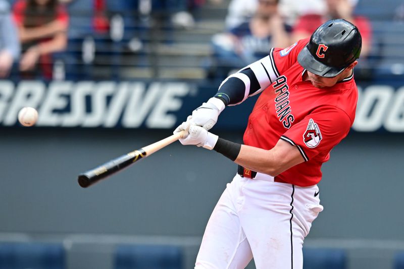 May 14, 2025; Cleveland, Ohio, USA; Cleveland Guardians center fielder Nolan Jones (22) hits an RBI single during the fourth inning against the Milwaukee Brewers at Progressive Field. Mandatory Credit: Ken Blaze-Imagn Images