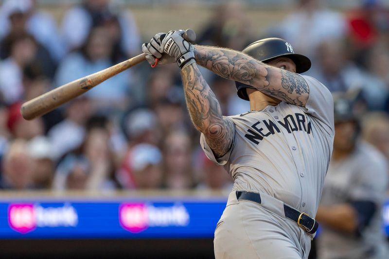 May 14, 2024; Minneapolis, Minnesota, USA; New York Yankees left fielder Alex Verdugo (24) hits a two run double against the Minnesota Twins in the fourth inning at Target Field. Mandatory Credit: Jesse Johnson-USA TODAY Sports