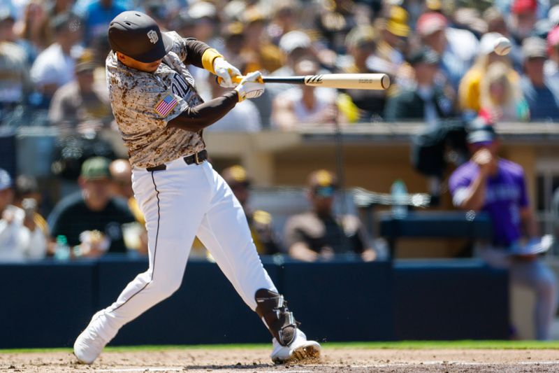 Apr 13, 2025; San Diego, California, USA;  San Diego Padres second baseman Jose Iglesias (7) hits a double during the fourth inning against the Colorado Rockies at Petco Park. Mandatory Credit: David Frerker-Imagn Images