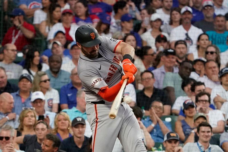 Jun 18, 2024; Chicago, Illinois, USA; San Francisco Giants catcher Curt Casali (18) hits a two-run double against the Chicago Cubs during the fifth inning at Wrigley Field. Mandatory Credit: David Banks-USA TODAY Sports