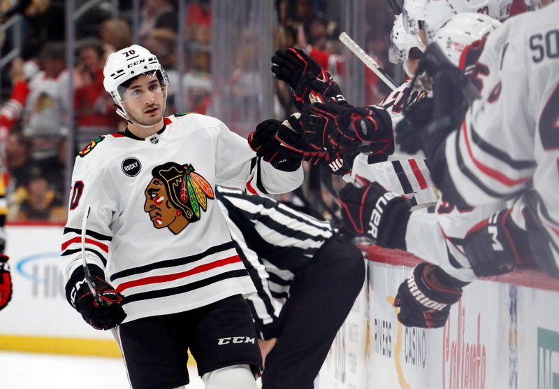 Oct 10, 2023; Pittsburgh, Pennsylvania, USA; Chicago Blackhawks center Cole Guttman (70) celebrates with the Chicago bench after scoring the game winning goal against the Pittsburgh Penguins during the third period at the PPG Paints Arena. Chicago won 4-2. Mandatory Credit: Charles LeClaire-USA TODAY Sports