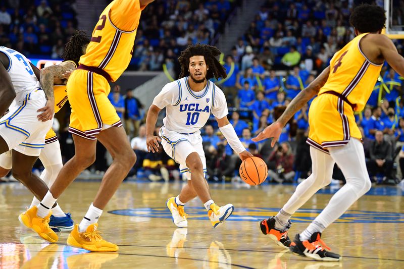 Mar 2, 2023; Los Angeles, California, USA; UCLA Bruins guard Tyger Campbell (10) moves the ball against the Arizona State Sun Devils during the second half at Pauley Pavilion. Mandatory Credit: Gary A. Vasquez-USA TODAY Sports