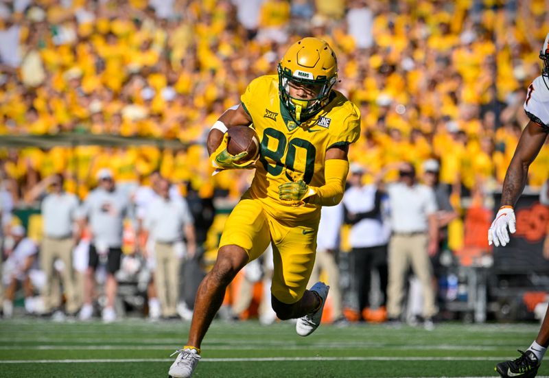 Oct 1, 2022; Waco, Texas, USA; Baylor Bears wide receiver Monaray Baldwin (80) runs with the ball after a catch against the Oklahoma State Cowboys during the second half at McLane Stadium. Mandatory Credit: Jerome Miron-USA TODAY Sports