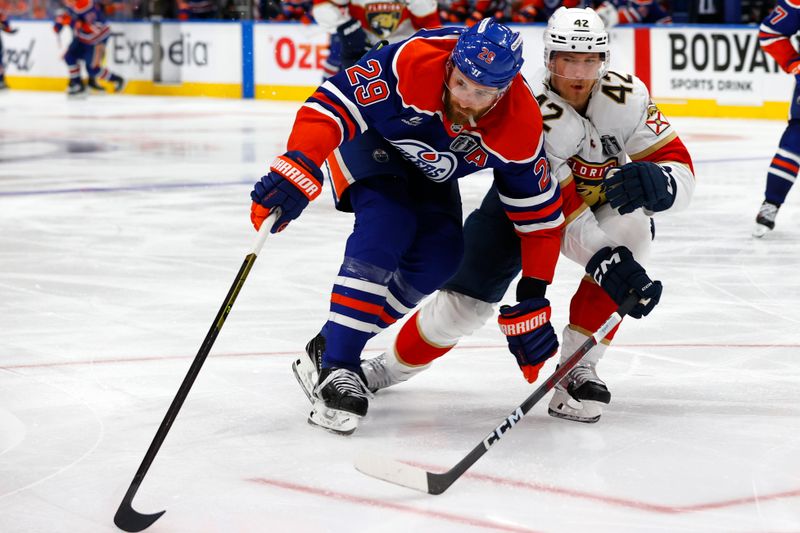 Jun 6, 2025; Edmonton, Alberta, CAN; Edmonton Oilers center Leon Draisaitl (29) skates past Florida Panthers defenseman Gustav Forsling (42) during double overtime in game two of the 2025 Stanley Cup Final at Rogers Place. Mandatory Credit: Perry Nelson-Imagn Images