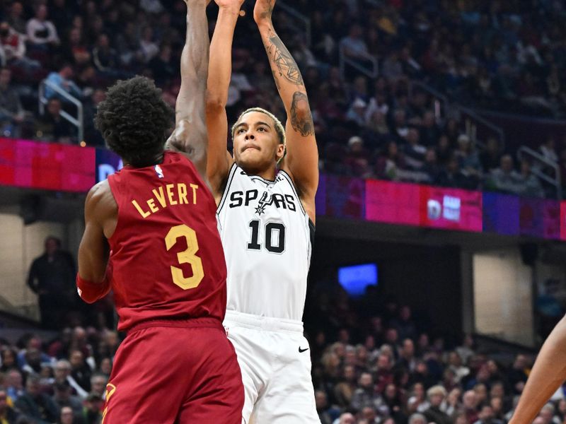 CLEVELAND, OHIO - FEBRUARY 13: Jeremy Sochan #10 of the San Antonio Spurs shoots over Caris LeVert #3 of the Cleveland Cavaliers during the second quarter at Rocket Mortgage Fieldhouse on February 13, 2023 in Cleveland, Ohio. NOTE TO USER: User expressly acknowledges and agrees that, by downloading and or using this photograph, User is consenting to the terms and conditions of the Getty Images License Agreement. (Photo by Jason Miller/Getty Images)