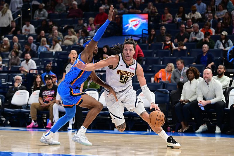 OKLAHOMA CITY, OKLAHOMA - JANUARY 31: Aaron Gordon #50 of the Denver Nuggets attempts to drive past Shai Gilgeous-Alexander #2 of the Oklahoma City Thunder during the second half at Paycom Center on January 31, 2024 in Oklahoma City, Oklahoma. NOTE TO USER: User expressly acknowledges and agrees that, by downloading and or using this Photograph, user is consenting to the terms and conditions of the Getty Images License Agreement. (Photo by Joshua Gateley/Getty Images)