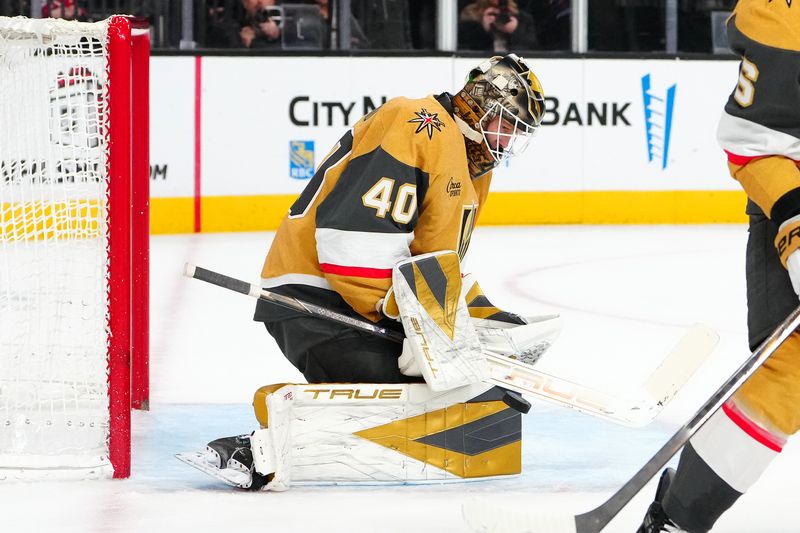 Nov 26, 2025; Las Vegas, Nevada, USA; Vegas Golden Knights goaltender Akira Schmid (40) makes a save against the Ottawa Senators during the second period at T-Mobile Arena. Mandatory Credit: Stephen R. Sylvanie-Imagn Images