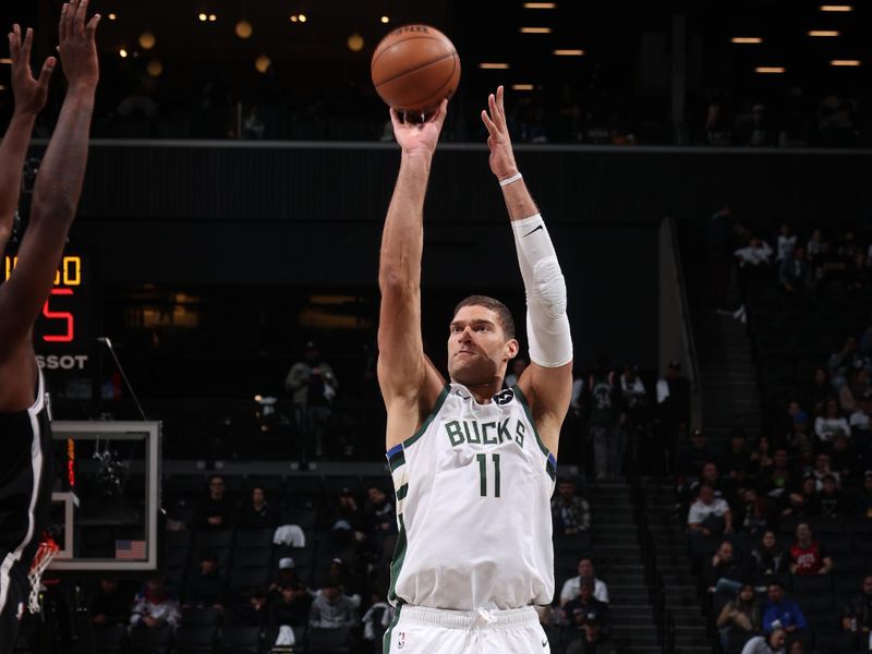 BROOKLYN, NY - OCTOBER 27: Brook Lopez #11 of the Milwaukee Bucks shoots the ball during the game against the Brooklyn Nets on October 27, 2024 at Barclays Center in Brooklyn, New York. NOTE TO USER: User expressly acknowledges and agrees that, by downloading and or using this Photograph, user is consenting to the terms and conditions of the Getty Images License Agreement. Mandatory Copyright Notice: Copyright 2024 NBAE (Photo by Nathaniel S. Butler/NBAE via Getty Images)