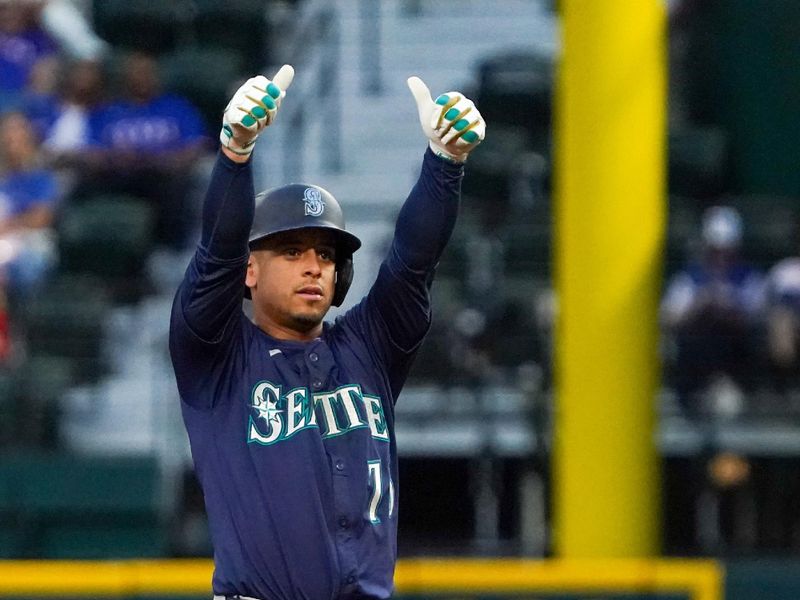May 3, 2025; Arlington, Texas, USA; Seattle Mariners second baseman Leo Rivas (76) reacts towards the dugout after hitting a double during the seventh inning against the Texas Rangers at Globe Life Field. Mandatory Credit: Raymond Carlin III-Imagn Images