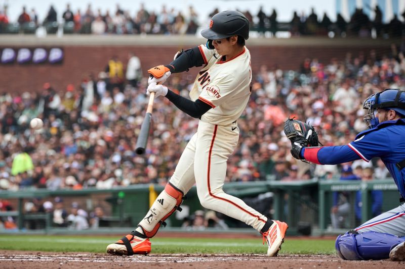 Apr 27, 2025; San Francisco, California, USA; San Francisco Giants outfielder Jung Hoo Lee (51) bats against the Texas Rangers during the third inning at Oracle Park. Mandatory Credit: Robert Edwards-Imagn Images
