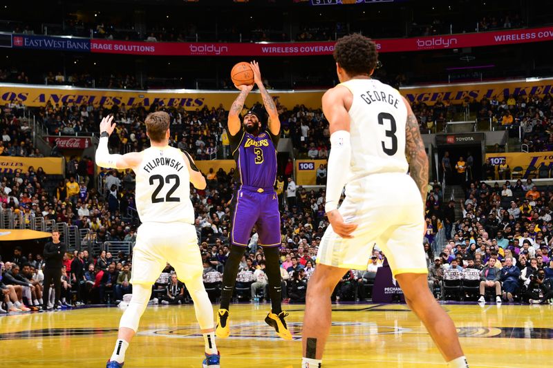 LOS ANGELES, CA - NOVEMBER 19: Anthony Davis #3 of the Los Angeles Lakers shoots the ball during the game against the Utah Jazz during the Emirates NBA Cup game on November 19, 2024 at Crypto.Com Arena in Los Angeles, California. NOTE TO USER: User expressly acknowledges and agrees that, by downloading and/or using this Photograph, user is consenting to the terms and conditions of the Getty Images License Agreement. Mandatory Copyright Notice: Copyright 2024 NBAE (Photo by Adam Pantozzi/NBAE via Getty Images)