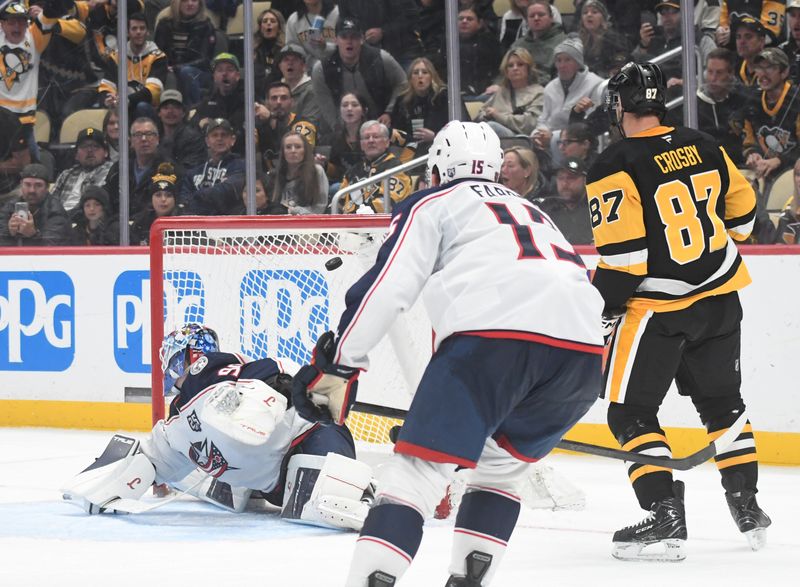 Oct 25, 2025; Pittsburgh, Pennsylvania, USA; Pittsburgh Penguins center Sidney Crosby (87) watches as a Bryan Rust shot makes it past Columbus Blue Jackets goalie Elvis Merzlikins (90) during third period action at PPG Paints Arena. Mandatory Credit: Philip G. Pavely-Imagn Images