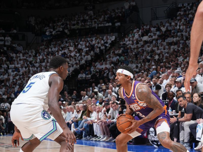 MINNEAPOLIS, MN -  APRIL 23: Bradley Beal #3 of the Phoenix Suns handles the ball against Anthony Edwards #5 of the Minnesota Timberwolves during the game during Round One Game Two of the 2024 NBA Playoffs on April 23, 2024 at Target Center in Minneapolis, Minnesota. NOTE TO USER: User expressly acknowledges and agrees that, by downloading and or using this Photograph, user is consenting to the terms and conditions of the Getty Images License Agreement. Mandatory Copyright Notice: Copyright 2024 NBAE (Photo by Jordan Johnson/NBAE via Getty Images)