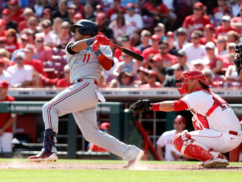 Sep 20, 2023; Cincinnati, Ohio, USA; Minnesota Twins second baseman Jorge Polanco (11) hits a two-run single against the Cincinnati Reds during the ninth inning at Great American Ball Park. Mandatory Credit: David Kohl-USA TODAY Sports