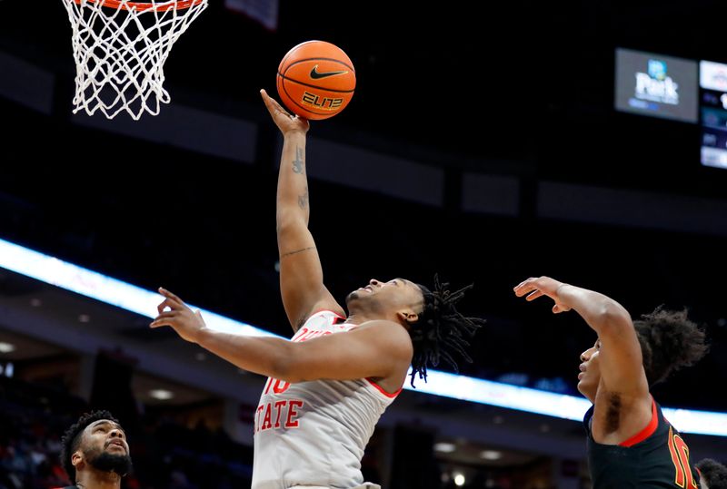 Mar 1, 2023; Columbus, Ohio, USA; Ohio State Buckeyes forward Brice Sensabaugh (10) shoots the ball against  Maryland Terrapins forward Julian Reese (10) during the second half at Value City Arena. Mandatory Credit: Joseph Maiorana-USA TODAY Sports